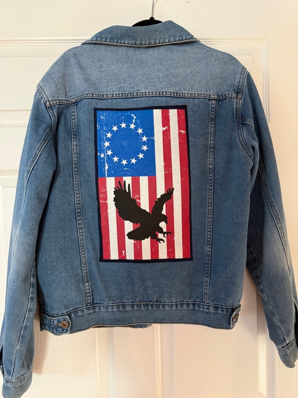 Upcycled Light Blue Denim Trucker Jacket with American Eagle on back.